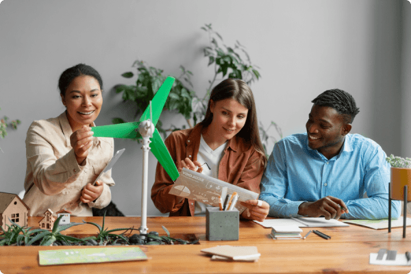 engineers with a windmill model